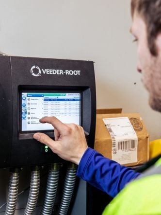 View of Westmor Service Tech using a tank monitor.
