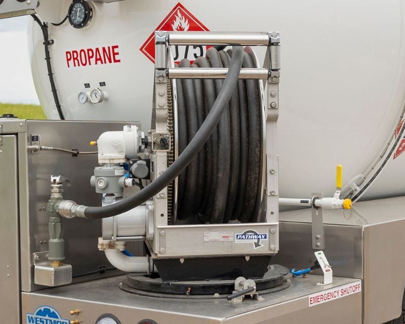 Swiveling hose reel on a blueline distribution trailer.