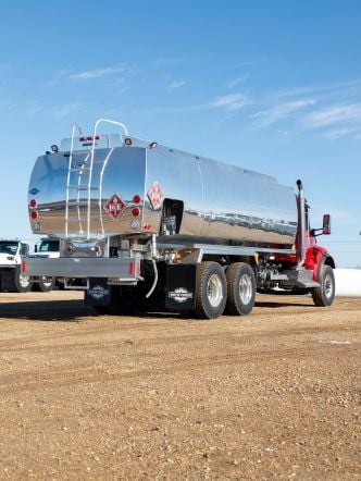 Westmor’s Transtech Full Canopy Model Refined Fuel Delivery Truck parked on a gravel lot.