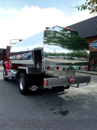 Westmor’s Transtech Nassau Wrap Model Refined Fuel Delivery Truck parked on a gravel lot.