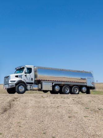 Westmor’s Transtech Rear Bucket Box Refined Fuel Delivery Truck parked on a gravel lot.