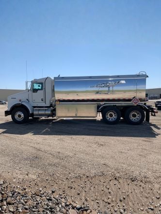 Westmor’s Transtech Side Delivery Refined Fuel Truck parked on a gravel lot.