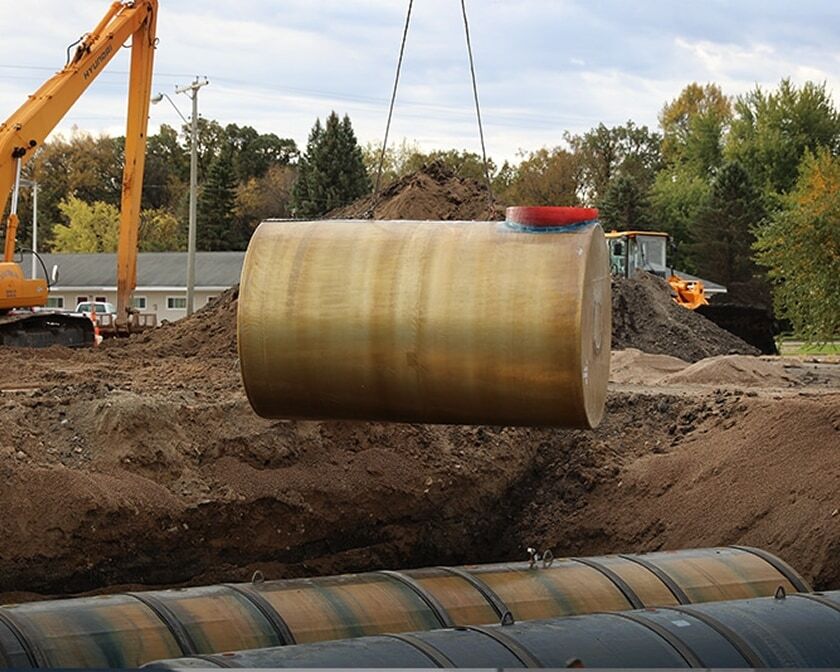Below-ground DEF storage tank being installed. 