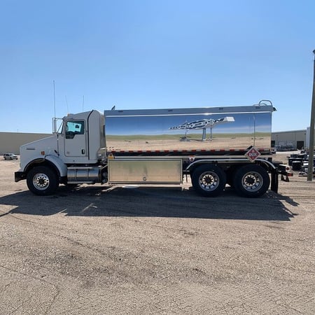 Westmor’s Transtech Side Delivery Refined Fuel Truck parked on a gravel lot. 