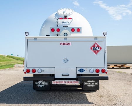 Westmor propane delivery truck with an enclosed deck. 