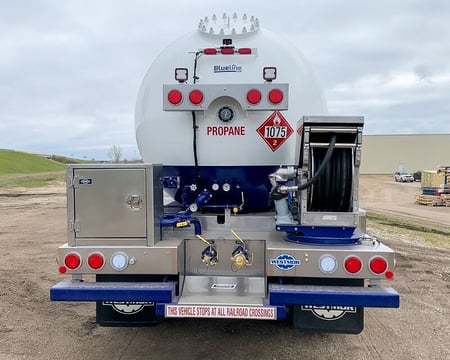 Westmor propane delivery truck with an open deck.