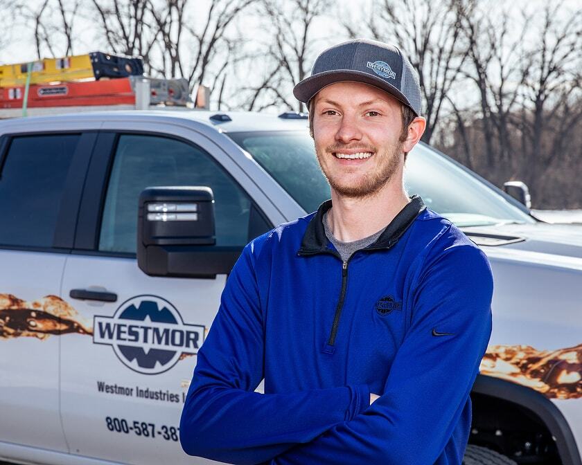 Westmor service tech standing by service truck. 